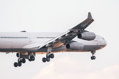 Airplane flying against clear sky