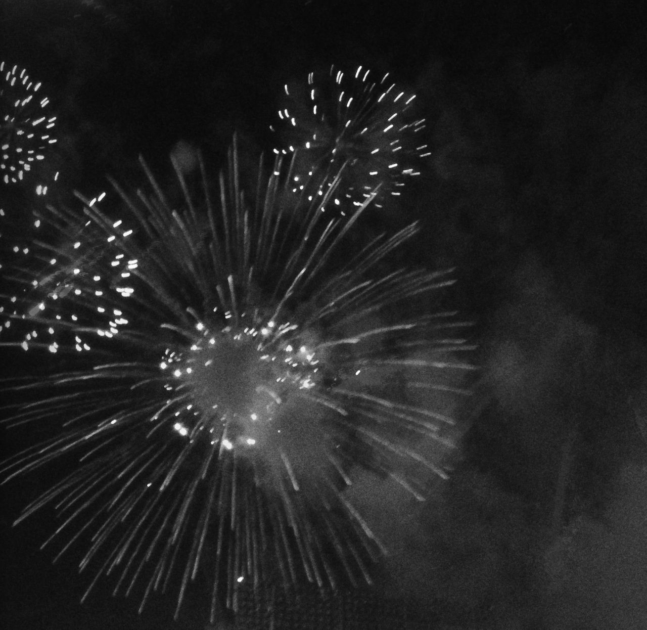 night, firework display, illuminated, celebration, exploding, low angle view, firework - man made object, glowing, long exposure, motion, arts culture and entertainment, sparks, event, firework, blurred motion, entertainment, sky, celebration event, outdoors, no people