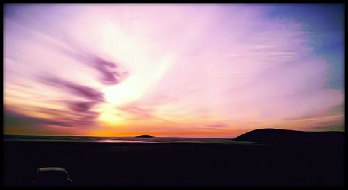 Scenic view of landscape against sky at sunset