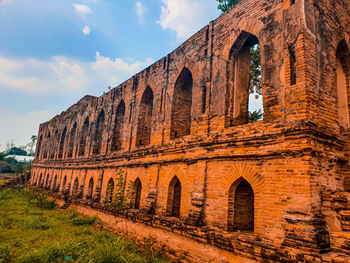 Low angle view of old building against sky