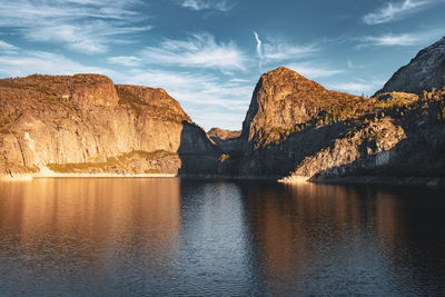 Scenic view of lake and mountains against sky