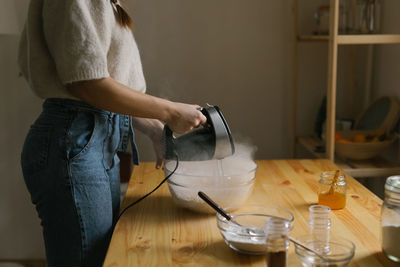 Young woman making christmas cookies