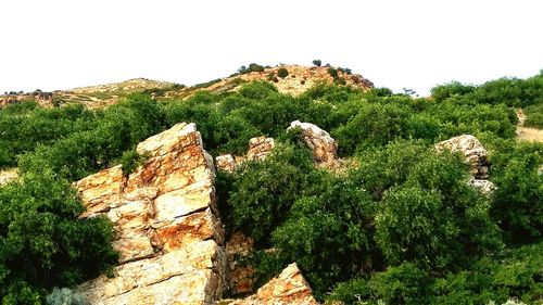 Rock formations on landscape against sky