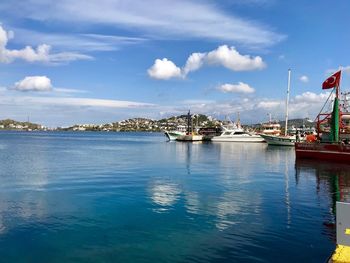 Boats moored at harbor