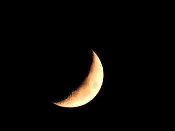 Low angle view of moon against sky at night