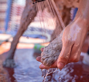 Close-up of hand holding water