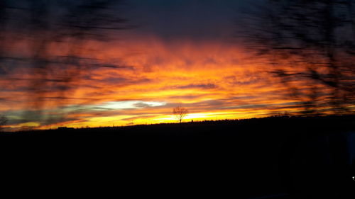 Scenic view of dramatic sky during sunset