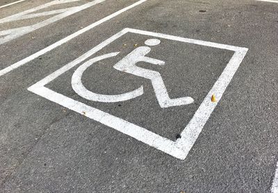 High angle view of arrow sign on road