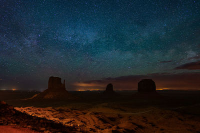 Scenic view of landscape against sky at night