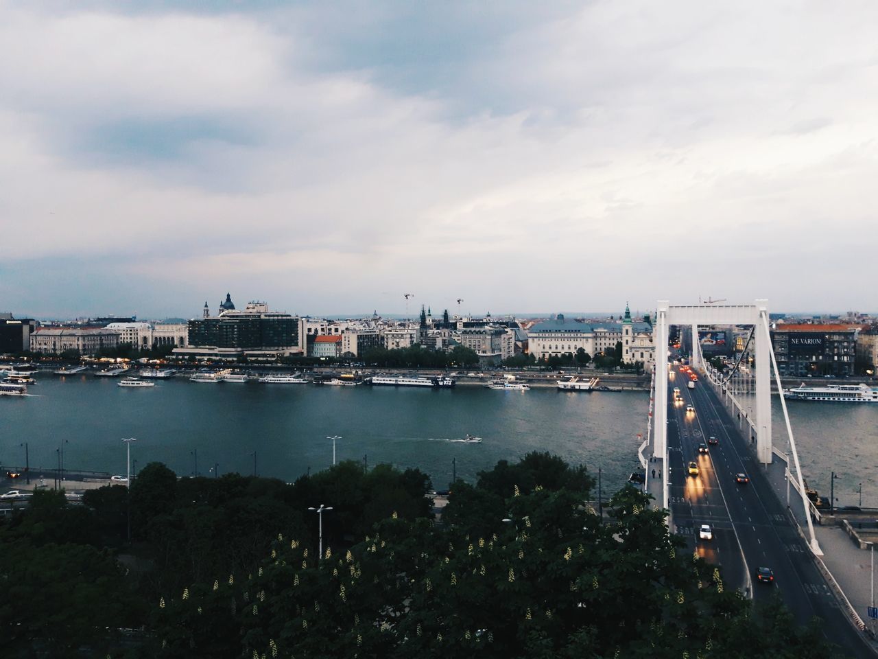 cloud - sky, architecture, built structure, sky, transportation, water, building exterior, city, nature, no people, river, connection, high angle view, bridge, mode of transportation, nautical vessel, cityscape, bridge - man made structure, outdoors