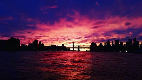 Dramatic sky over city at sunset