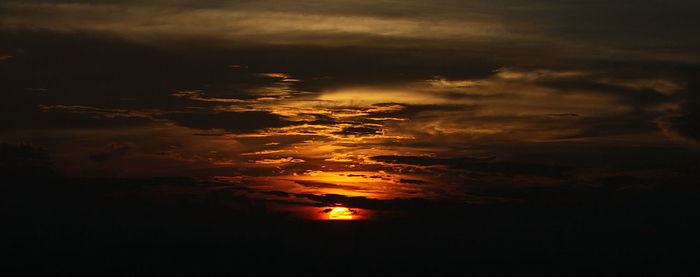 Scenic view of dramatic sky during sunset