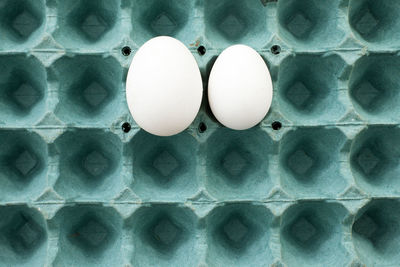 Directly above shot of eggs in carton