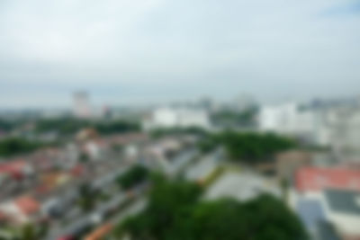 High angle view of buildings in city against sky