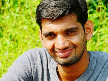 Close-up portrait of a smiling young man