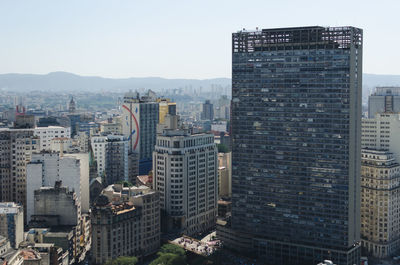 High angle view of buildings in city against sky