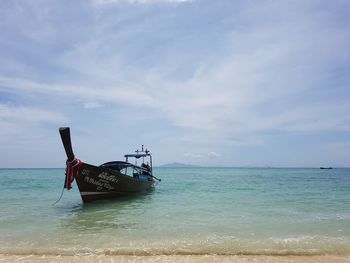 Boat in sea against sky