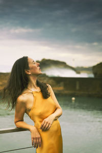 Woman with yellow dress on the basque-french coast v