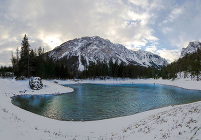 Panoramic view of green lake in sunny winter day famous tourist destination in styria region austria