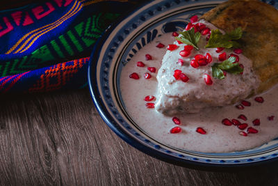 Chile en nogada on a talavera plate from puebla, traditional cuisine of mexico