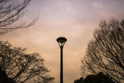 Low angle view of street light against sky