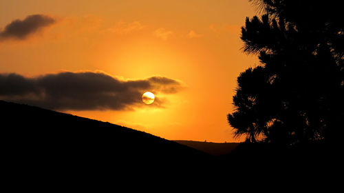 Scenic view of mountains at sunset
