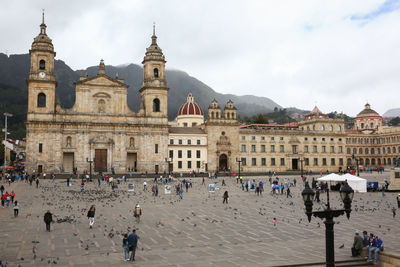 Group of people in front of historic building