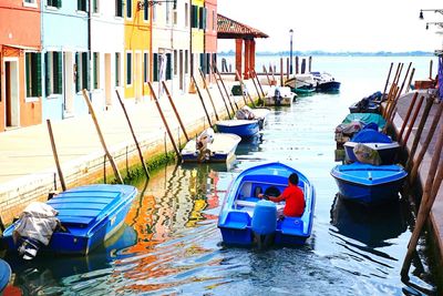 Boats moored at harbor