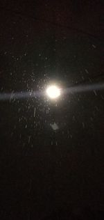 Low angle view of illuminated street light against sky at night