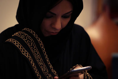 Close-up of woman looking at camera