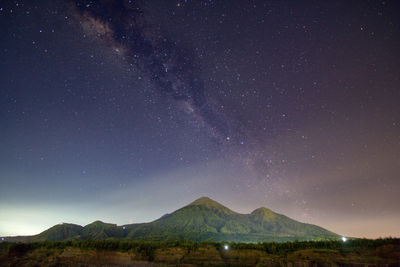 Scenic view of star field against sky at night