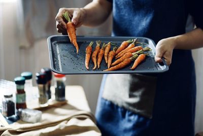 Midsection of man preparing food