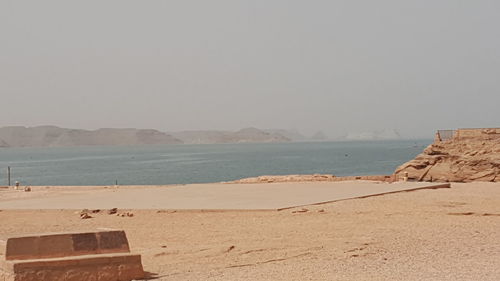 Scenic view of beach against clear sky