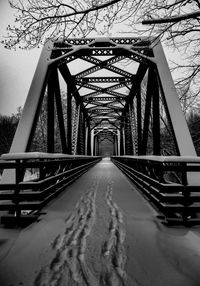 Footbridge over snow covered bridge