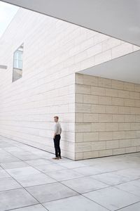 Man standing on tiled floor