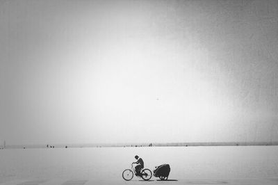 Full length of woman sitting in water