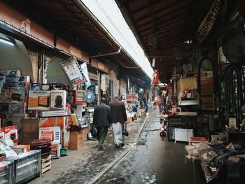 People walking on street market in city