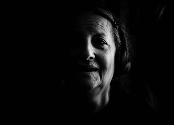 Close-up portrait of smiling senior woman