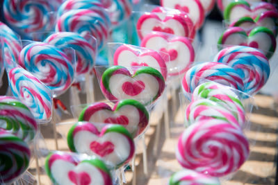 Close-up of colorful lollipops arranged at market