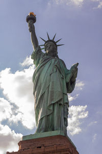 Low angle view of statue against sky