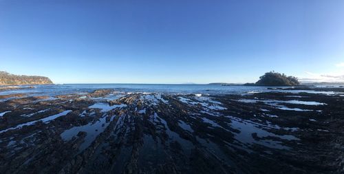 Scenic view of sea against clear sky