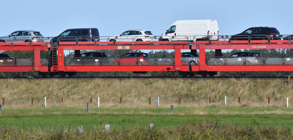 Train on railroad track against clear sky