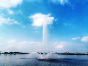 View of fountain in water against sky