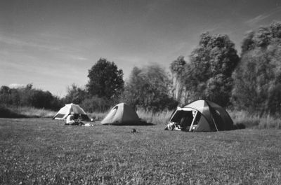 Tent on field against sky