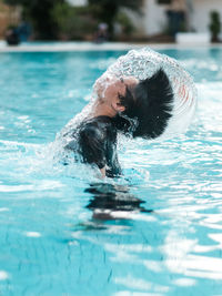 Portrait of woman swimming in sea