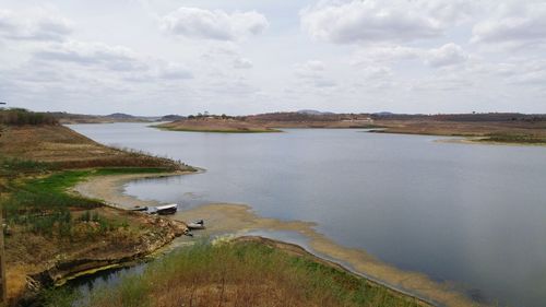 View of lake against cloudy sky