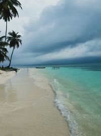 Scenic view of beach against sky