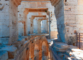  the interior of the colosseum or coliseum in arles, france. selective focus