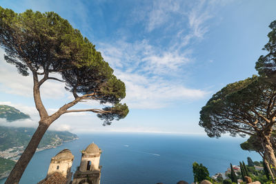 Scenic view of sea by building against sky