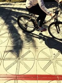 Low section of woman standing on tiled floor